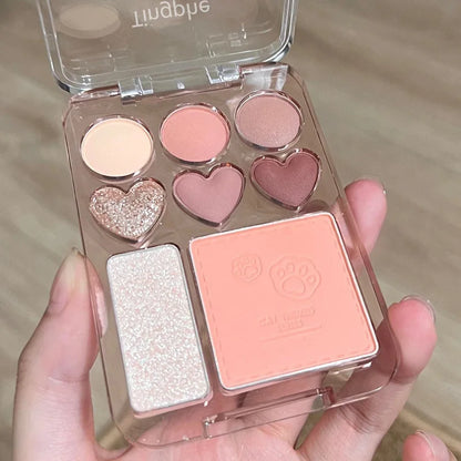Heart-shaped eyeshadow palette with 8 pink, orange, and brightening blush and highlighter shades from Blushimmer.