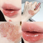 Blushimmer water-glossy mirror lip glaze showing a shiny, moisturizing lip gloss with a plump, sparkling finish on lips.