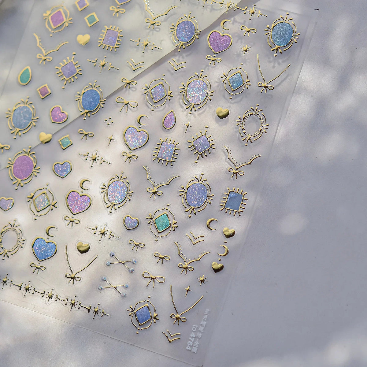Colorful Cat's Eye 5D gradient European love heart gem nail art stickers by Blushimmer, featuring geometric wing crystals for manicures.