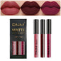 Set of three Blushimmer liquid lipsticks in red, blue, purple, and nude shades with matte, waterproof, long-lasting formulas.