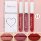 Set of four liquid lipsticks by Blushimmer in black, blue, purple, and green with matte finish and long-lasting waterproof formula.