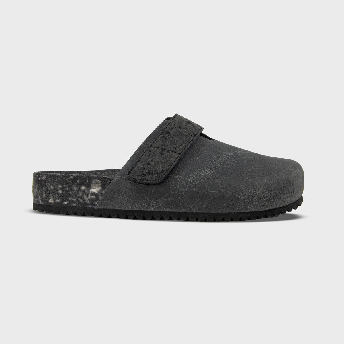 Fleks More Mesa Clog in After Dark color, side profile showing black slip-on clog with textured sole and rounded toe.