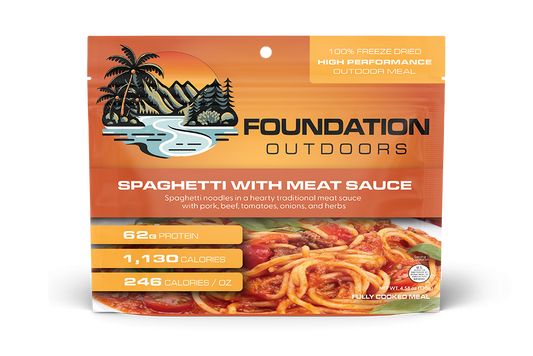 Foundation Outdoors spaghetti with meat sauce meal in a pouch, showing cooked spaghetti topped with savory meat sauce.