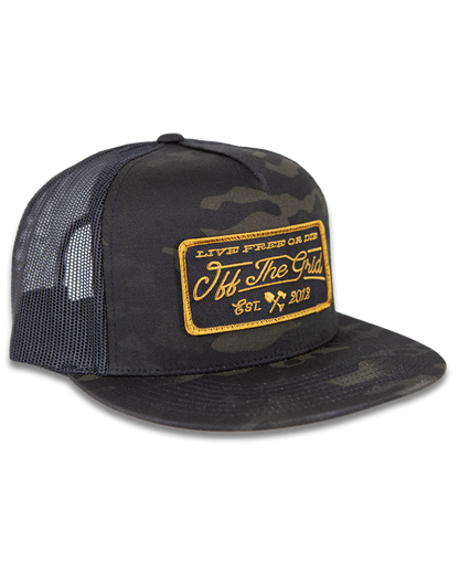 Black camouflage stamped snapback hat by Off The Grid Surplus with bold front logo and adjustable strap.