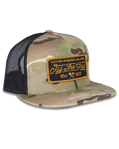 Off The Grid Surplus stamped snapback hat with Multicam pattern, featuring a bold stamped logo on the front.