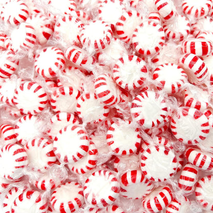 Assorted Starlight Peppermint Hard Candy from Candy In Bulk in a clear bag showing red and white striped candies.