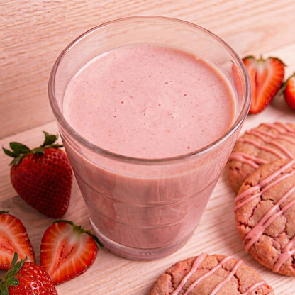 AmBari Nutrition Strawberry Blast smoothie shake with fresh strawberries and creamy texture in a clear glass.