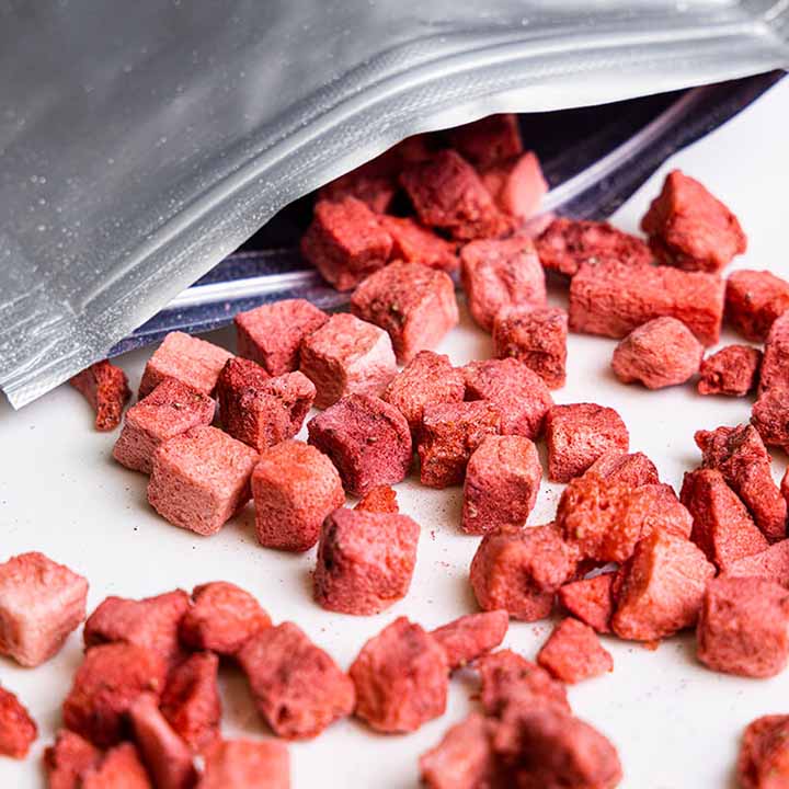 Bag of sweetened freeze-dried strawberry dices by VFD.US, showing vibrant red freeze-dried strawberries in a clear bag.