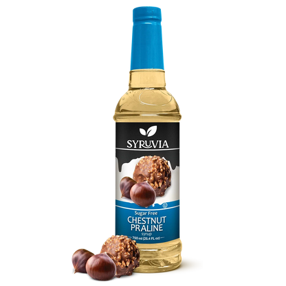 Bottle of Syruvia sugar-free chestnut praline syrup with a clear label and golden cap, suitable for flavoring coffee and desserts.