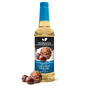 Bottle of Syruvia sugar-free chestnut praline syrup with a clear label and golden cap, suitable for flavoring coffee and desserts.