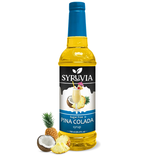 Sugar-free Pina Colada syrup by Syruvia in a clear bottle, showing the golden liquid and label for tropical flavored drink enhancement.