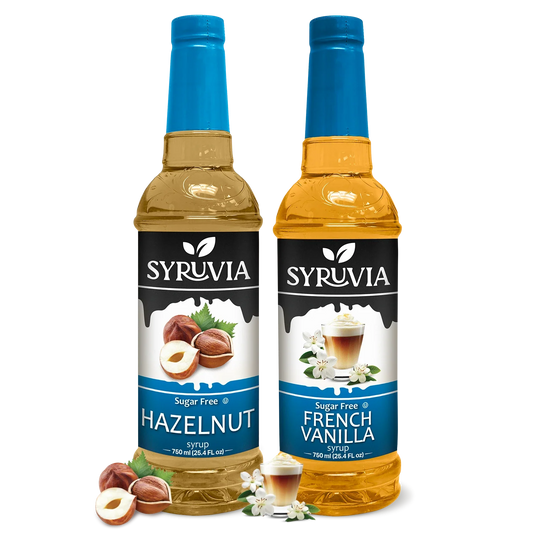 Sugar free hazelnut and French vanilla syrups from SYRUVIA in glass bottles, ideal for flavoring coffee and beverages.