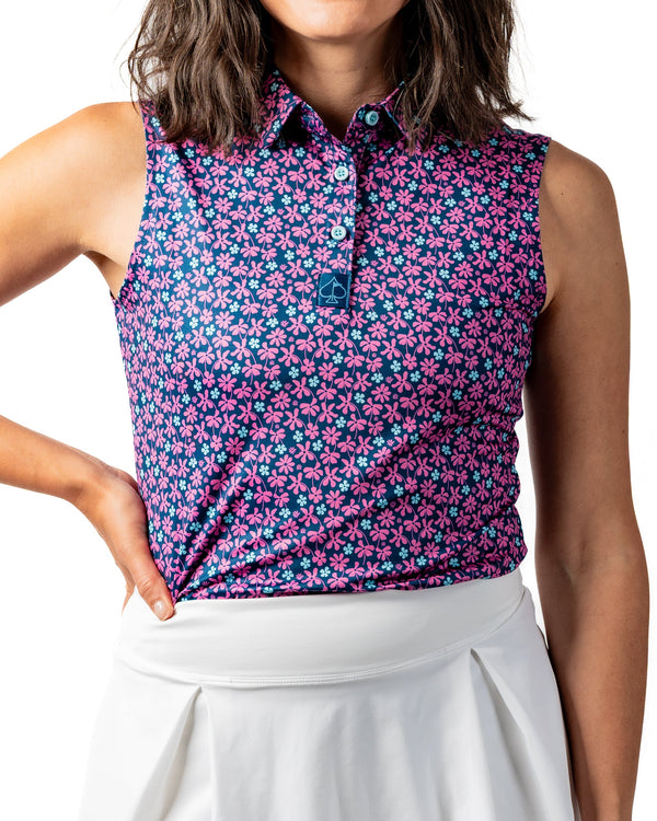 Women's Full Bloom polo shirt by Pins and Aces, featuring floral design and casual fit, shown on a hanger.