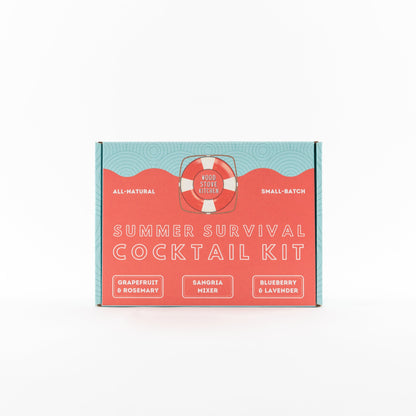Wood Stove Kitchen Summer Survival Kit with grapefruit, rosemary, sangria, blueberry, and lavender cocktail and mocktail mixers in 16oz bottles.