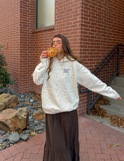 Unisex hoodie by Elevated Faith featuring a wildflower allover print with spiritual "Talk to God" design on the front.