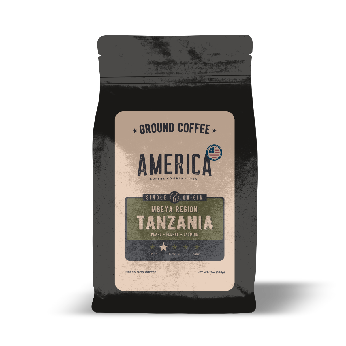 Ground Tanzania single origin coffee from America Supply Company LLC, showing fresh coffee grounds in a clear container.