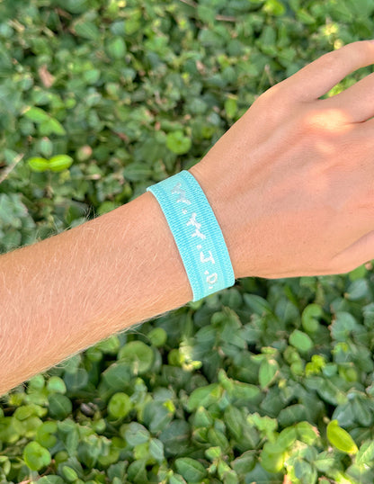 Teal WWJD embroidered wristband bracelet by Elevated Faith with stitched religious message and adjustable strap.