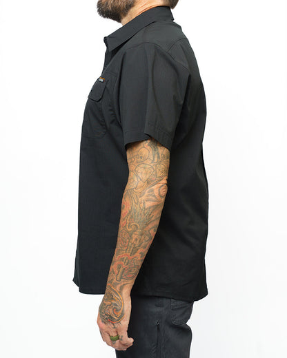 Vintage black Thunderbolt SS shirt by Off The Grid Surplus, featuring short sleeves and a bold thunderbolt design.
