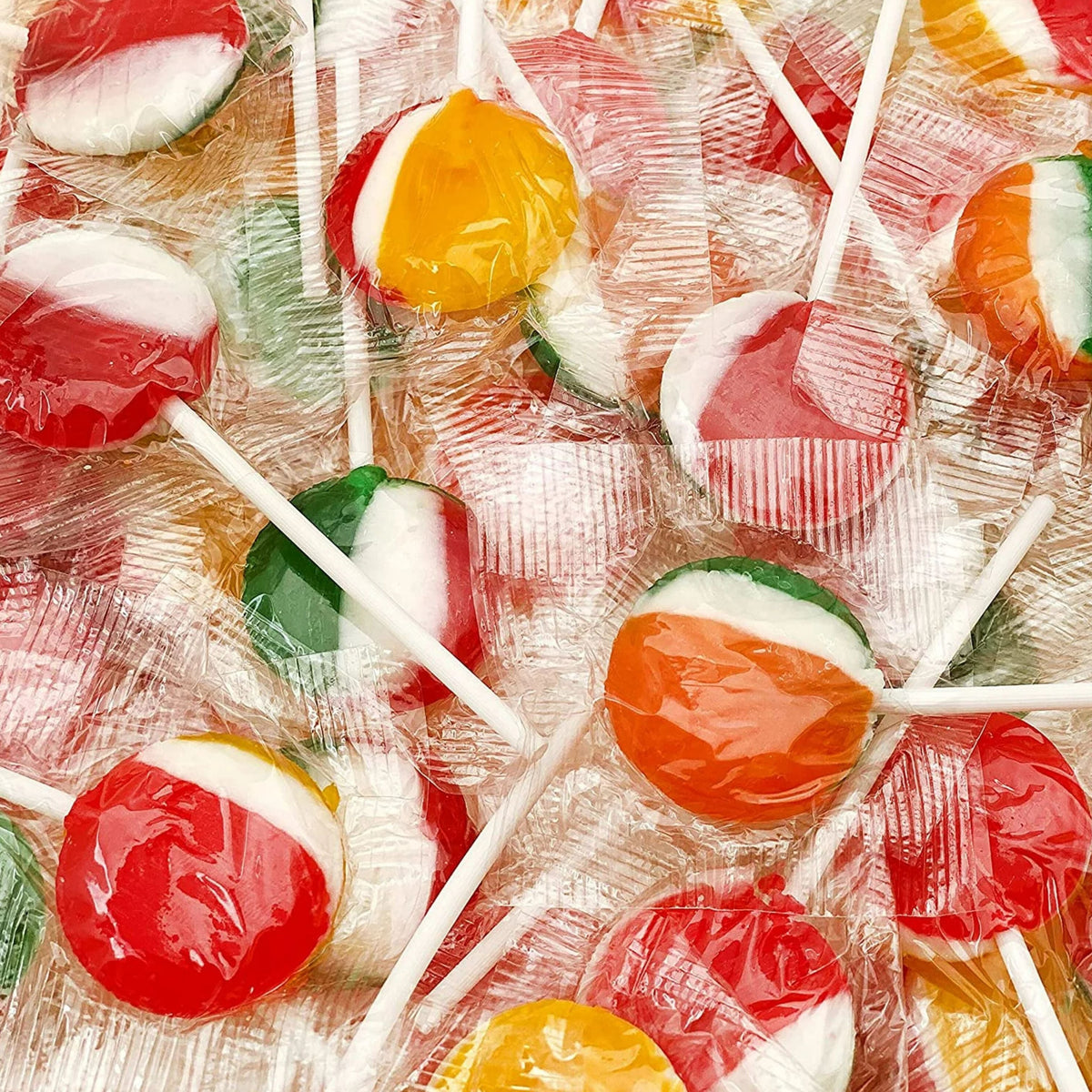 Assorted Tiger Pops lollipops in a bulk Candy In Bulk bag, colorful fruit flavors, fun tiger design on the lollipops.