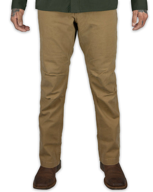Off The Grid Surplus Trailblazer Boot Cut Pants in Coyote, showing the rugged cargo-style pants with multiple pockets and sturdy fabric.