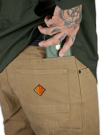 Off The Grid Surplus Trailblazer boot cut pants in coyote color, showcasing durable fabric and relaxed fit for outdoor wear.