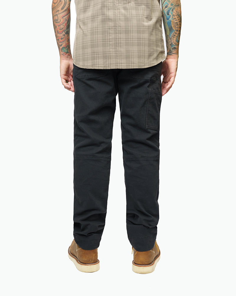 Off The Grid Surplus Trailblazer standard fit pants in vintage black, showing the relaxed fit and durable fabric.