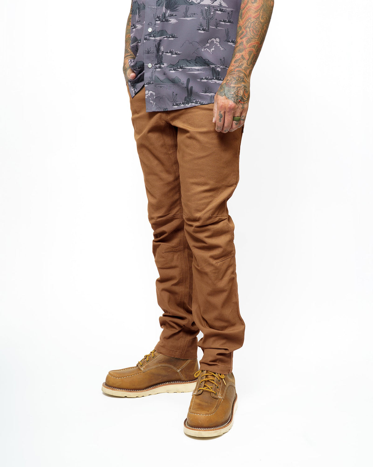 Tobacco-colored Trailblazer Taper Fit Pants from Off The Grid Surplus, showing the tapered design and waistband details.