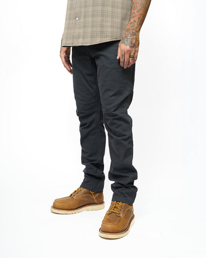 Off The Grid Surplus Trailblazer taper fit pants in vintage black, showing a close-up of the stylish, tapered leg design.