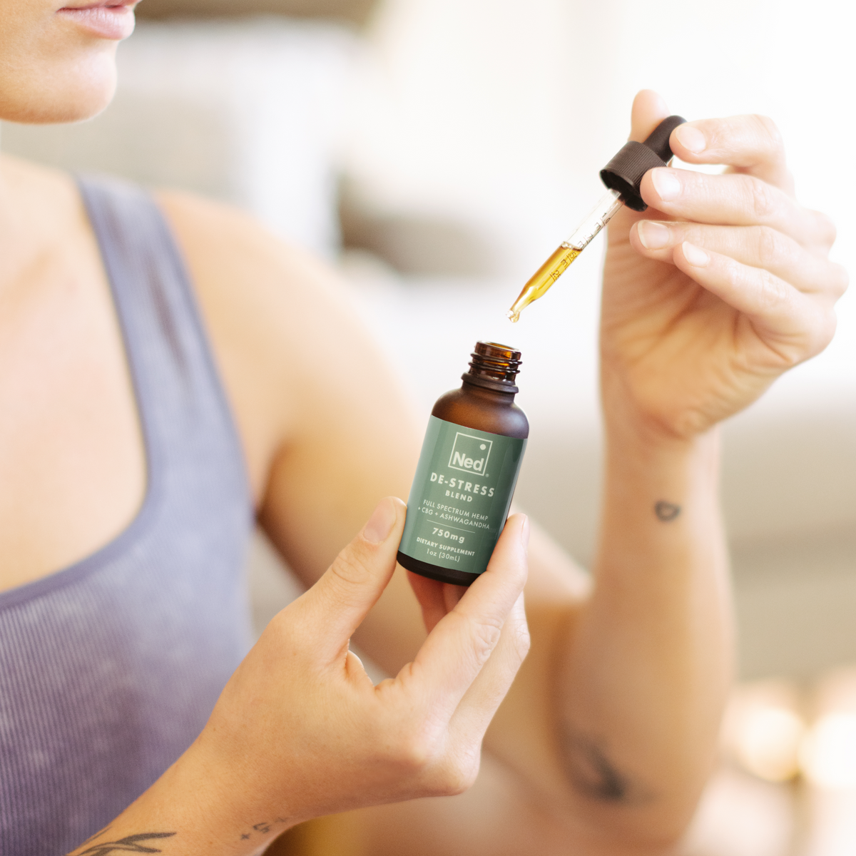 Foria De-Stress Blend oils and tinctures bottle with dropper, natural ingredients for relaxation and stress relief.
