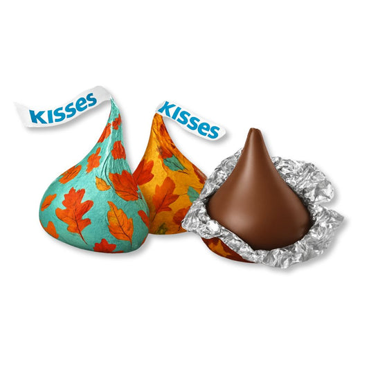 Hershey's Kisses Milk Chocolate candies with fall-themed foil wrappers in a bulk value bag, displayed on a white background.