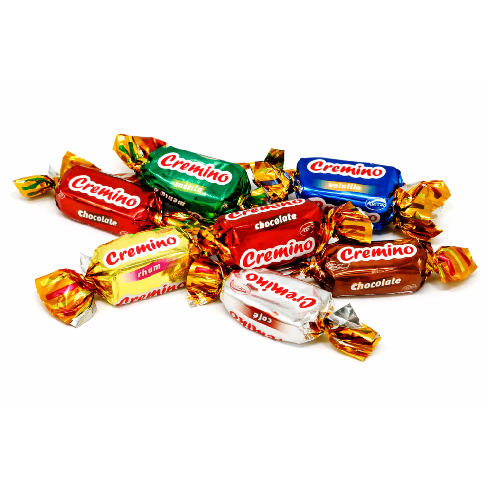 Assorted Arcor Cremino toffee chews in a bulk Candy In Bulk package, showcasing caramel and toffee candies in colorful wrappers.