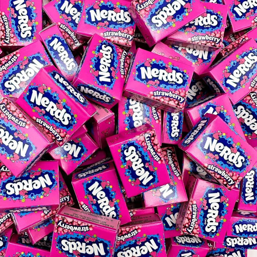 Assorted Nerds Strawberry candy in colorful mini boxes, featuring sweet and tangy crunchy candy from Candy In Bulk.