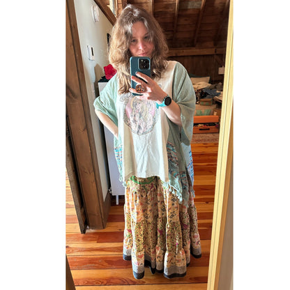 Limited edition Woodstock Dreams Fiesta Sunset skirt by Darn Good Yarn, featuring vibrant colors and flowing fabric.
