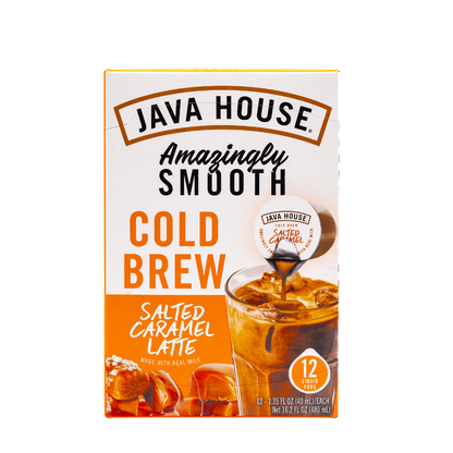 Cold brew latte with salted caramel flavor in a clear glass, topped with whipped cream and caramel drizzle, from Java House.