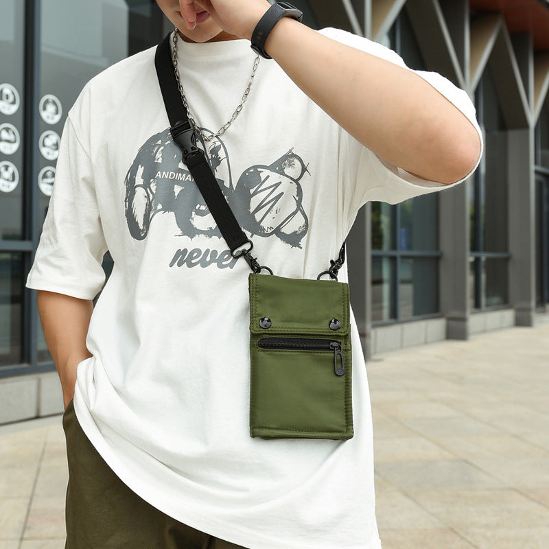 Green NNEDSZ water-resistant nylon crossbody bag for women, compact travel wallet and card holder with mobile phone compartment.