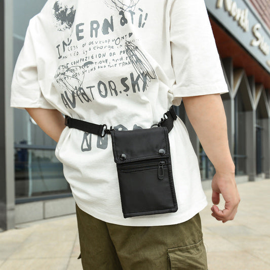 Black NNEDSZ water-resistant nylon crossbody bag with compact design, ideal for carrying mobile phones and cards for men and women.