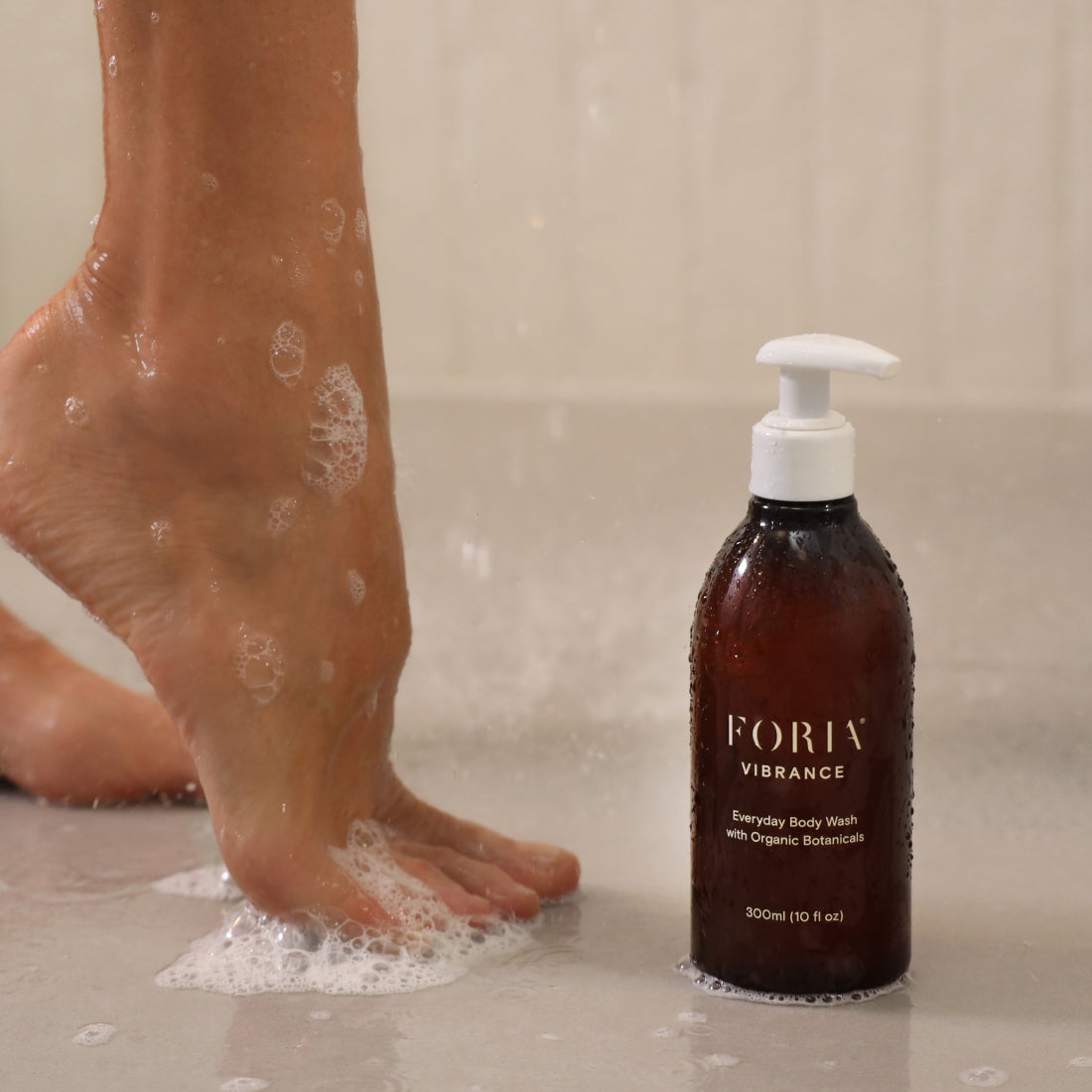 Foria Everyday Body Wash with organic botanicals, showcasing its smooth, herbal-infused texture in a clean, natural setting.
