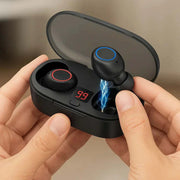 Wireless earbuds in black with charging case showing battery level and blue charging indicator light
