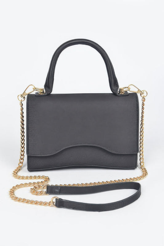 Women’s beige handbag by BYMANYC New York, featuring a structured design with gold-tone hardware and top handle.