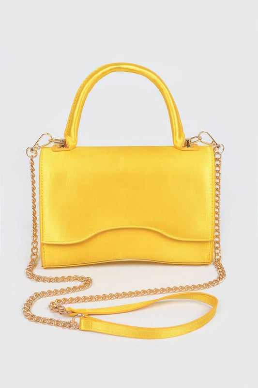 Women's black leather handbag by BYMANYC New York from the Cala Llenya collection, featuring elegant design and gold accents.