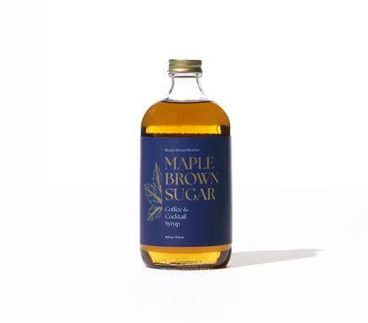 Maple and brown sugar coffee and cocktail syrup from Wood Stove Kitchen in a 16 fl oz bottle, used as a drink mixer and flavor enhancer.