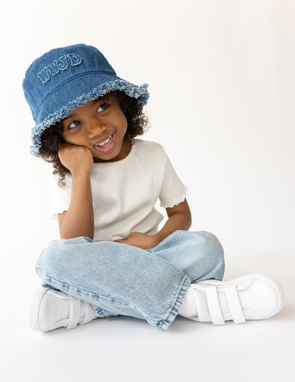 Kids denim bucket hat by Elevated Faith with WWJD design, featuring a wide brim and adjustable chin strap for sun protection.