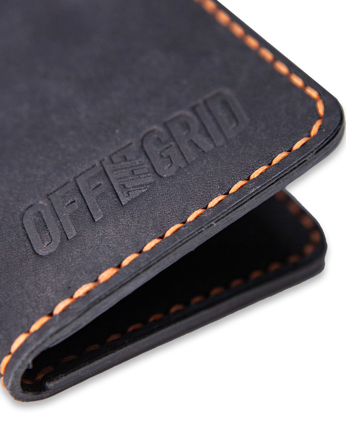 Off The Grid Surplus Borderland leather bifold wallet with multiple card slots and a sleek brown finish.