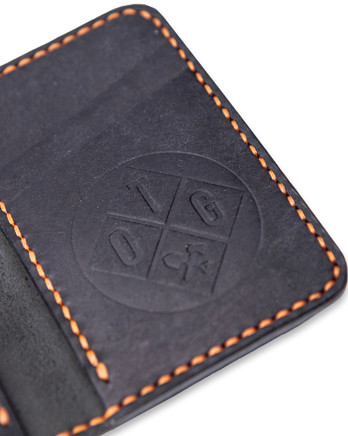 Off The Grid Surplus Borderland leather bifold wallet showing multiple card slots and sleek design.