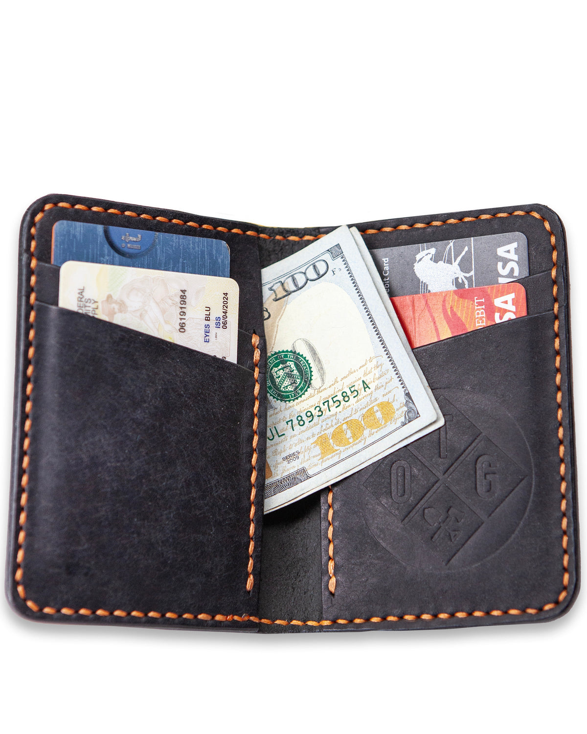 Off The Grid Surplus Borderland leather bifold wallet with multiple card slots and a sleek brown finish.