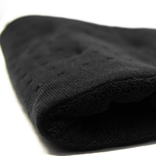 Close-up of iReliev weighted heating pad for hot and cold therapy, showing soft fabric and adjustable weight for pain relief.