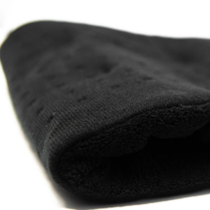 Close-up of iReliev weighted heating pad for hot and cold therapy, showing soft fabric and adjustable weight for pain relief.