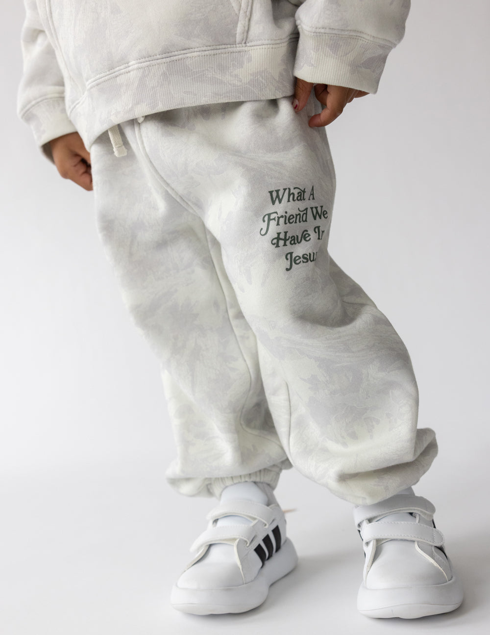 Kids camo sweatpants by Elevated Faith featuring "What a Friend in Jesus" print, made for comfortable, stylish children's wear.