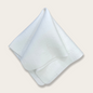 White Saint Minerals makeup remover shammy by Panoply Beauty, soft and reusable cloth for gentle facial cleansing.