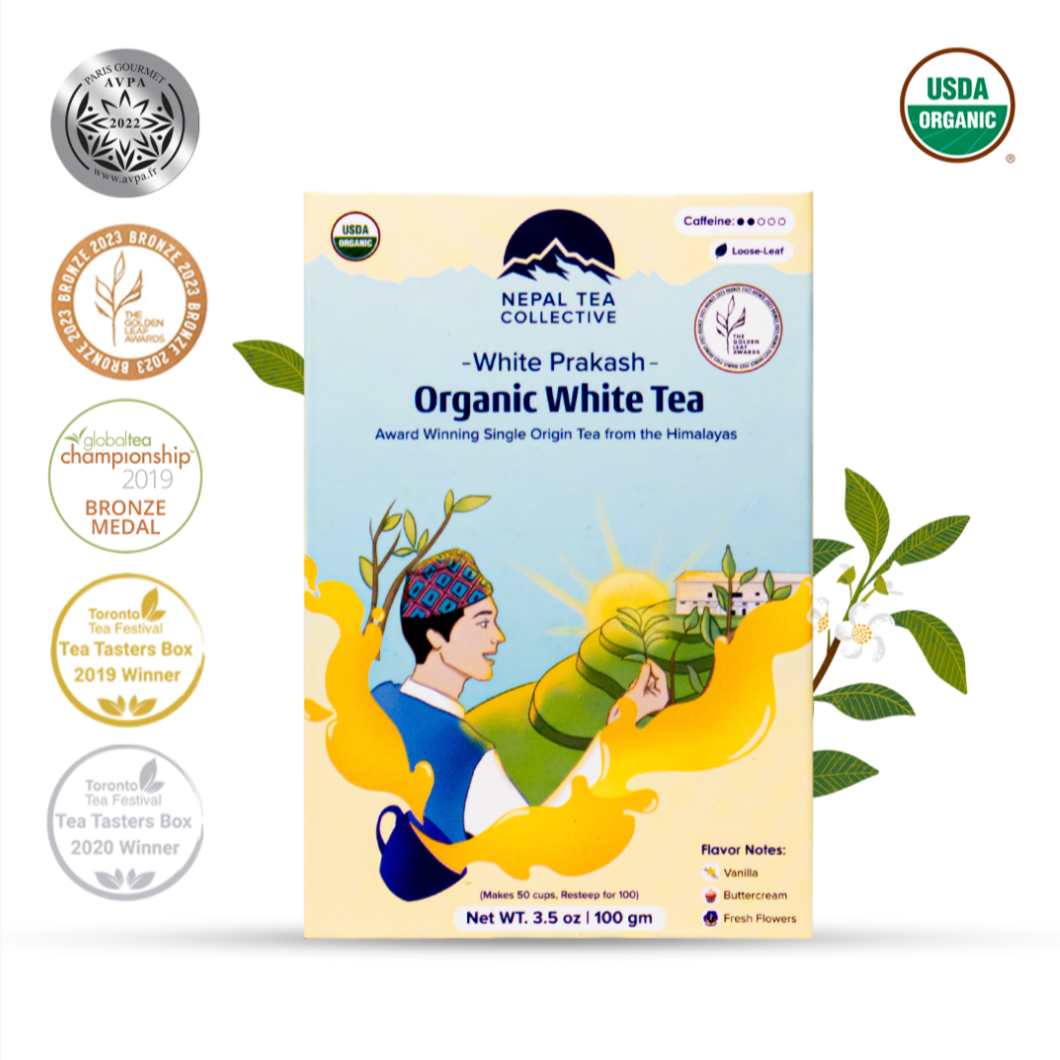 Organic White Prakash tea from Nepal Tea, brewed in a clear cup showing the light, delicate white tea leaves.